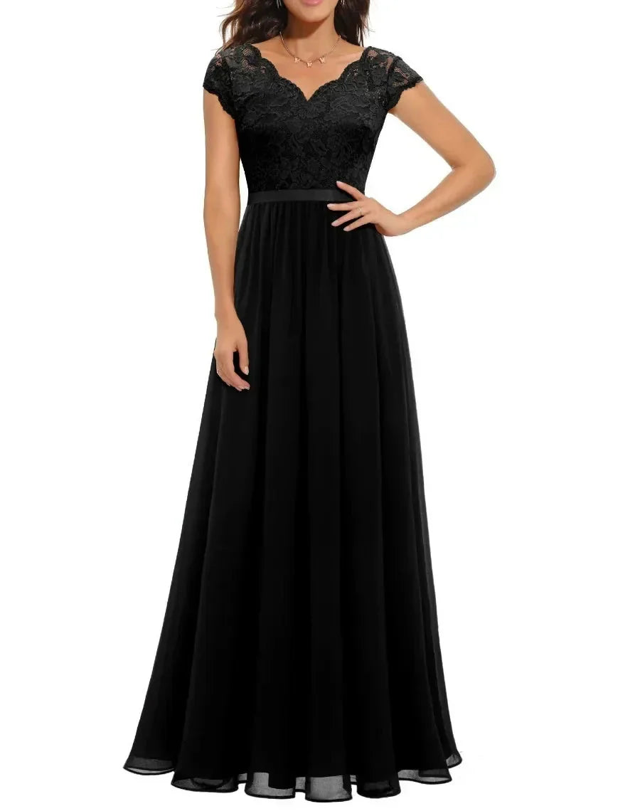 Black Short Sleeve - Woman wearing a long A-line maxi dress featuring a lace bodice with 3/4 sleeves and a flowing pleated georgette skirt