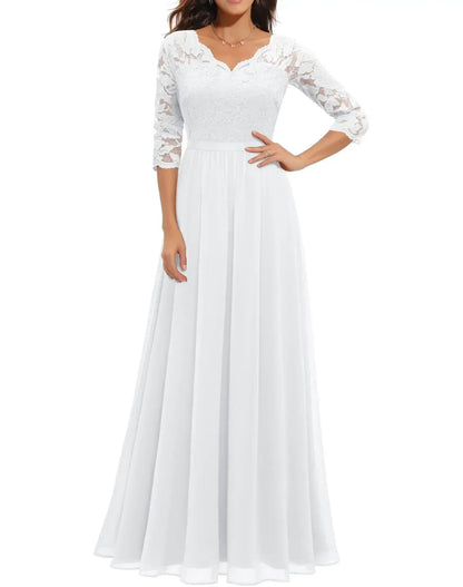 White Quarter Sleeve - Woman wearing a long A-line maxi dress featuring a lace bodice with 3/4 sleeves and a flowing pleated georgette skirt