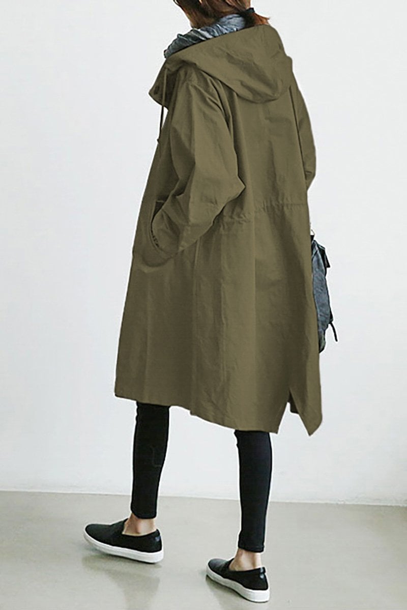 Army Green - A model wearing a light grey mid-length hooded coat with a single-breasted button front, styled with a black scarf and black pants against a plain white background.