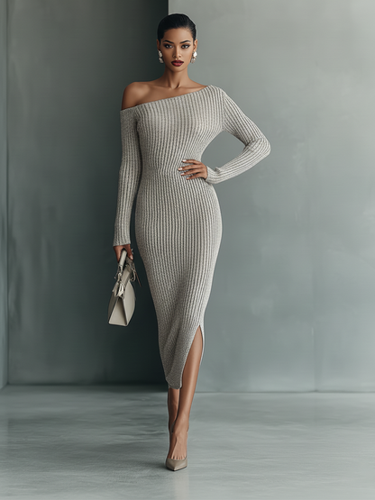 A woman wearing a grey ribbed knit off-the-shoulder maxi dress with long sleeves, a side slit, and a side pocket, holding a structured handbag.