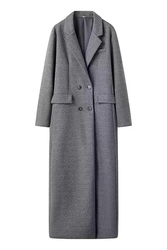 Grey - A woman wearing an oversized, double-breasted maxi coat in textured heather grey wool, featuring wide notched lapels and flap pockets, paired with a matching grey pillbox hat.