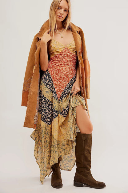 Multi - A model wearing a patchwork floral chiffon maxi dress with a lace-trimmed V-neckline and an asymmetric handkerchief hem.