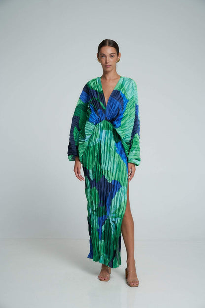 Green - Women's formal maxi dress featuring an all-over micro-pleated texture, bold green and blue abstract print, deep V-neckline, voluminous long sleeves, and a high side slit.