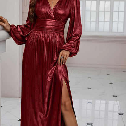 Red - Woman wearing a shiny metallic pleated long sleeve maxi dress with a wrap bodice, banded waist, and high leg slit, standing in a formal indoor setting.