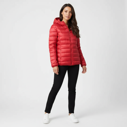 Red - A woman wearing an off-white hooded puffer jacket with horizontal quilting, zipped up, paired with blue jeans against a plain white background.