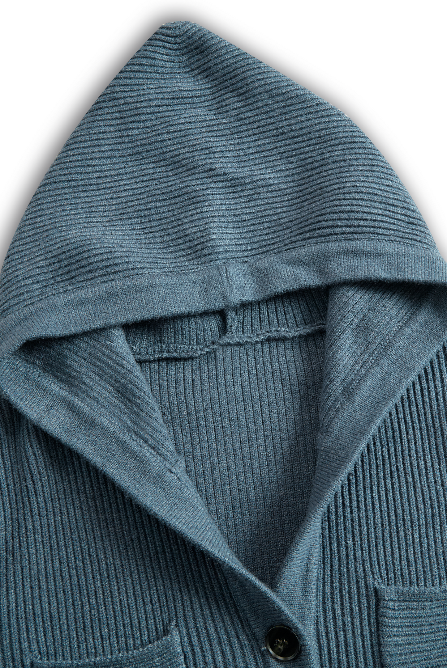 Green - A woman wearing a long-sleeve, blue-grey ribbed knit maxi dress featuring a hood, a button-down neckline, and chest flap pockets, paired with a woven tote bag.