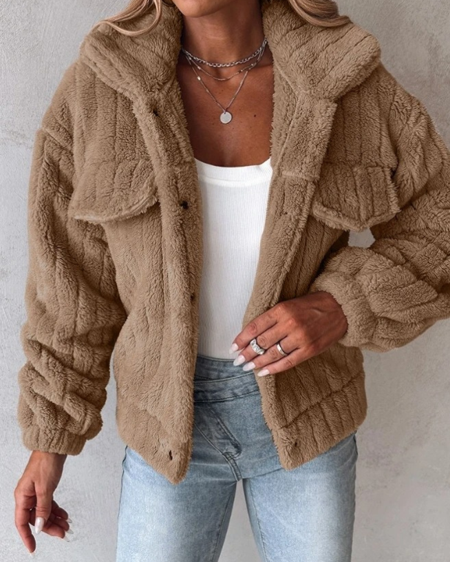 Brown - Women's cream-coloured heavyweight ribbed teddy jacket featuring a collared neckline, snap-button front, and twin chest flap pockets, styled open over a white top and light wash jeans.