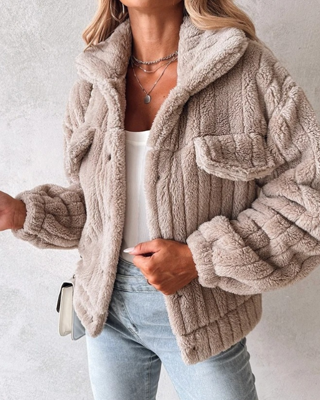 Khaki - Women's cream-coloured heavyweight ribbed teddy jacket featuring a collared neckline, snap-button front, and twin chest flap pockets, styled open over a white top and light wash jeans.