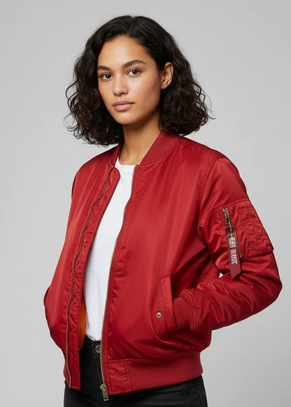 Red - A woman wearing a vibrant red satin-finish bomber jacket featuring a ribbed collar, zip-up front, and a utility pocket on the left sleeve, styled over a white t-shirt.