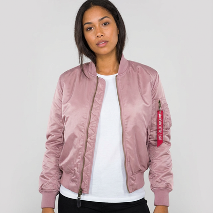 Pink - A woman wearing a vibrant red satin-finish bomber jacket featuring a ribbed collar, zip-up front, and a utility pocket on the left sleeve, styled over a white t-shirt.
