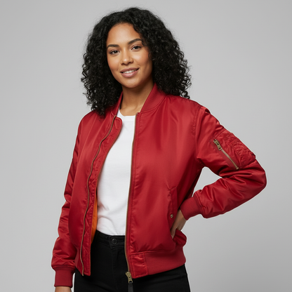 Red - A woman wearing a vibrant red satin-finish bomber jacket featuring a ribbed collar, zip-up front, and a utility pocket on the left sleeve, styled over a white t-shirt.