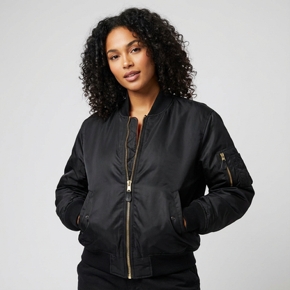 Black - A woman wearing a vibrant red satin-finish bomber jacket featuring a ribbed collar, zip-up front, and a utility pocket on the left sleeve, styled over a white t-shirt.