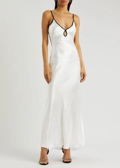Women's formal white satin maxi slip dress featuring a V-neckline with a front keyhole cutout and thin black contrast piping along the straps and bust.