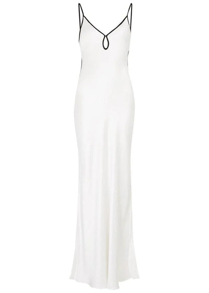 Women's formal white satin maxi slip dress featuring a V-neckline with a front keyhole cutout and thin black contrast piping along the straps and bust.
