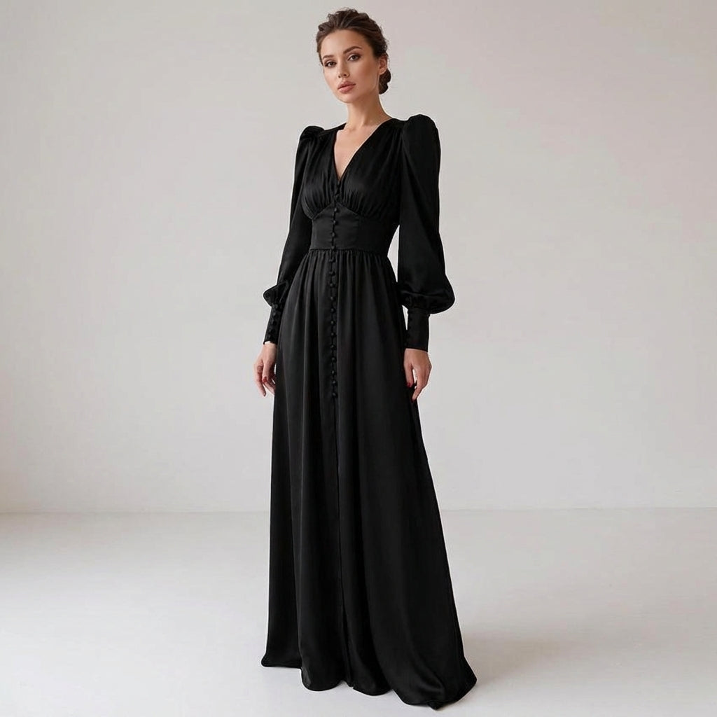 Black - A woman wearing a taupe-coloured satin midi dress featuring a V-neckline, a row of self-covered buttons down the front, a cinched waistband, and long bishop sleeves with extended buttoned cuffs.