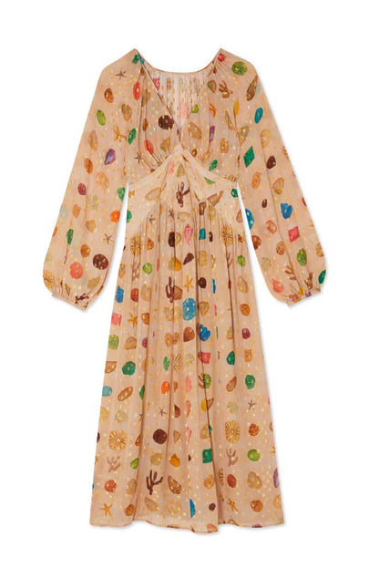 Multicolor - A woman leans against a textured stone wall wearing a peach-coloured maxi dress featuring a multi-coloured seashell motif, gold Lurex flecks, a plunging V-neckline, and long billowy sleeves.