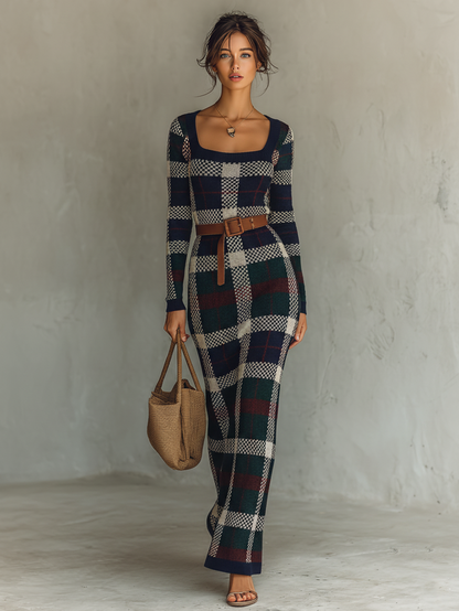 Navy - A woman wearing a long-sleeve, square-neck maxi knit dress featuring a classic navy, green, and white plaid pattern, styled with a brown leather belt at the waist.