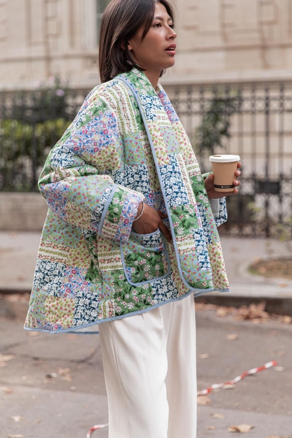 Multicolor - Women's relaxed-fit quilted jacket featuring a vibrant patchwork floral print in pastel greens and blues, styled open with contrast edge binding.