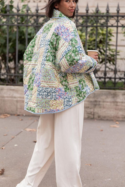 Multicolor - Women's relaxed-fit quilted jacket featuring a vibrant patchwork floral print in pastel greens and blues, styled open with contrast edge binding.