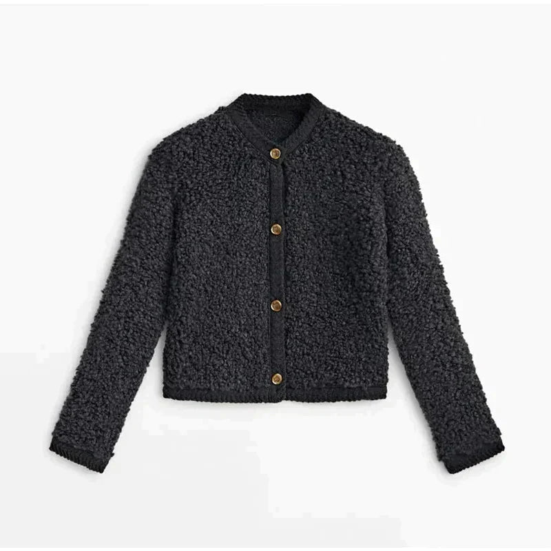 Black - A woman wearing a beige, textured boucle knit cardigan with a button-front closure, ribbed trims, and gold-tone buttons, styled casually over a white top and light blue jeans.