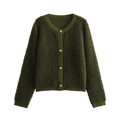 Olive Green - A woman wearing a beige, textured boucle knit cardigan with a button-front closure, ribbed trims, and gold-tone buttons, styled casually over a white top and light blue jeans.