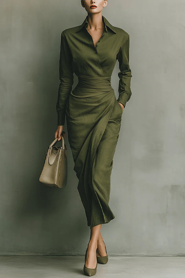 2XL - A woman wearing an elegant olive green textured midi dress with a pointed collar, long sleeves, a highly cinched ruched waist, and a draped wrap skirt with a side pocket.