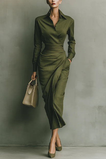 2XL - A woman wearing an elegant olive green textured midi dress with a pointed collar, long sleeves, a highly cinched ruched waist, and a draped wrap skirt with a side pocket.