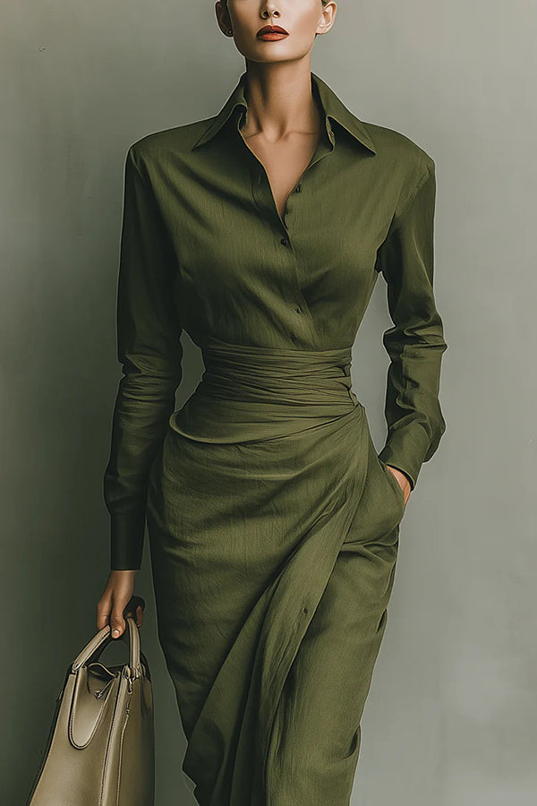 2XL - A woman wearing an elegant olive green textured midi dress with a pointed collar, long sleeves, a highly cinched ruched waist, and a draped wrap skirt with a side pocket.