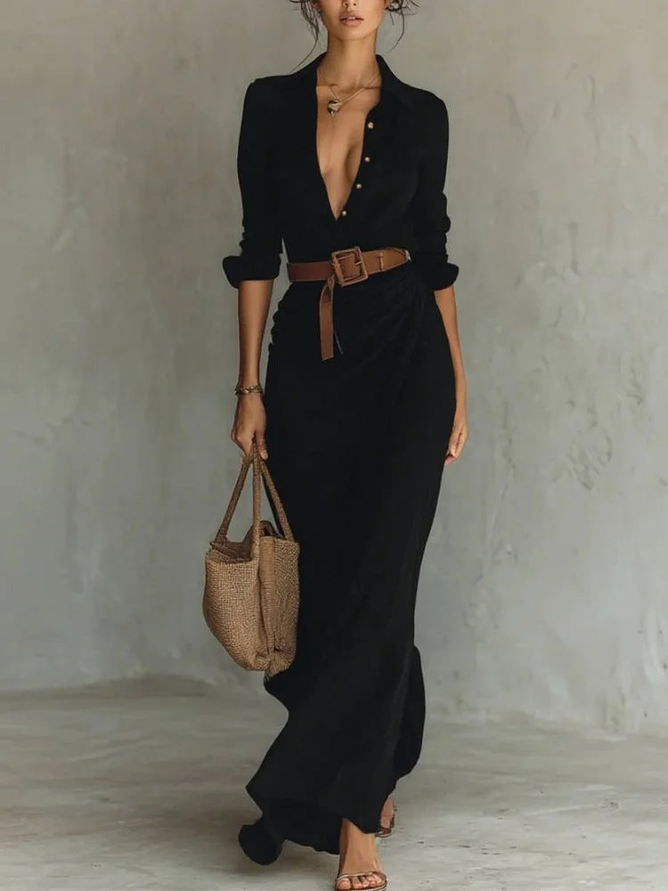 Black - A woman wearing a sand-coloured, textured crepe maxi shirt dress with a plunging collared neckline, ruched waist detailing, and a draped wrap-effect skirt.