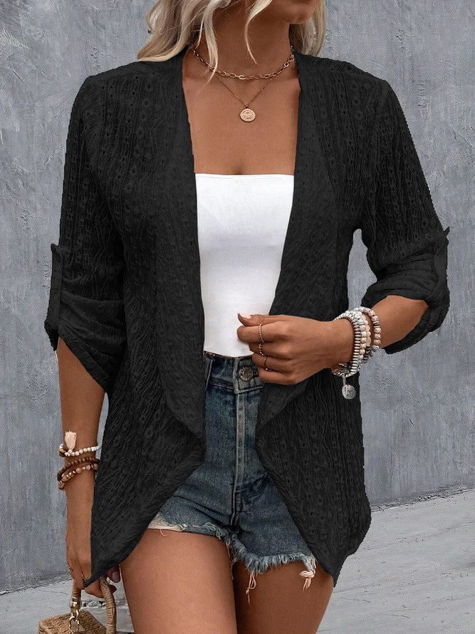 Black - Women's white lightweight open-front cardigan featuring a textured eyelet pattern, draped lapels, and roll-tab sleeves, styled over a white top and denim shorts.