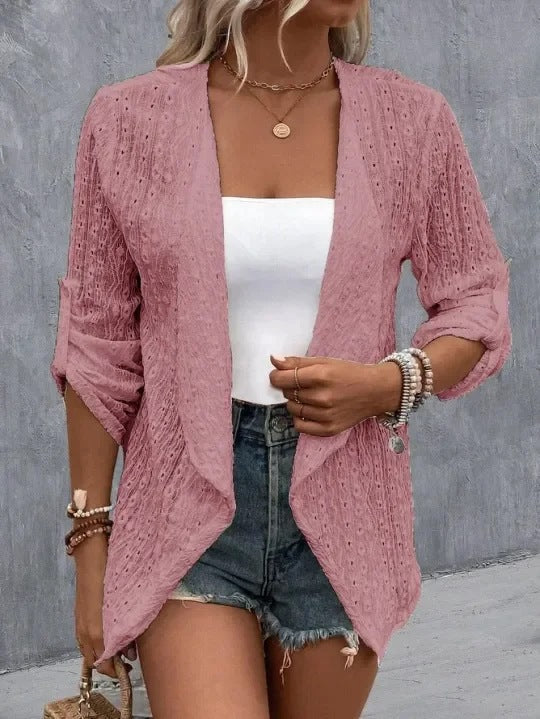 Pink - Women's white lightweight open-front cardigan featuring a textured eyelet pattern, draped lapels, and roll-tab sleeves, styled over a white top and denim shorts.