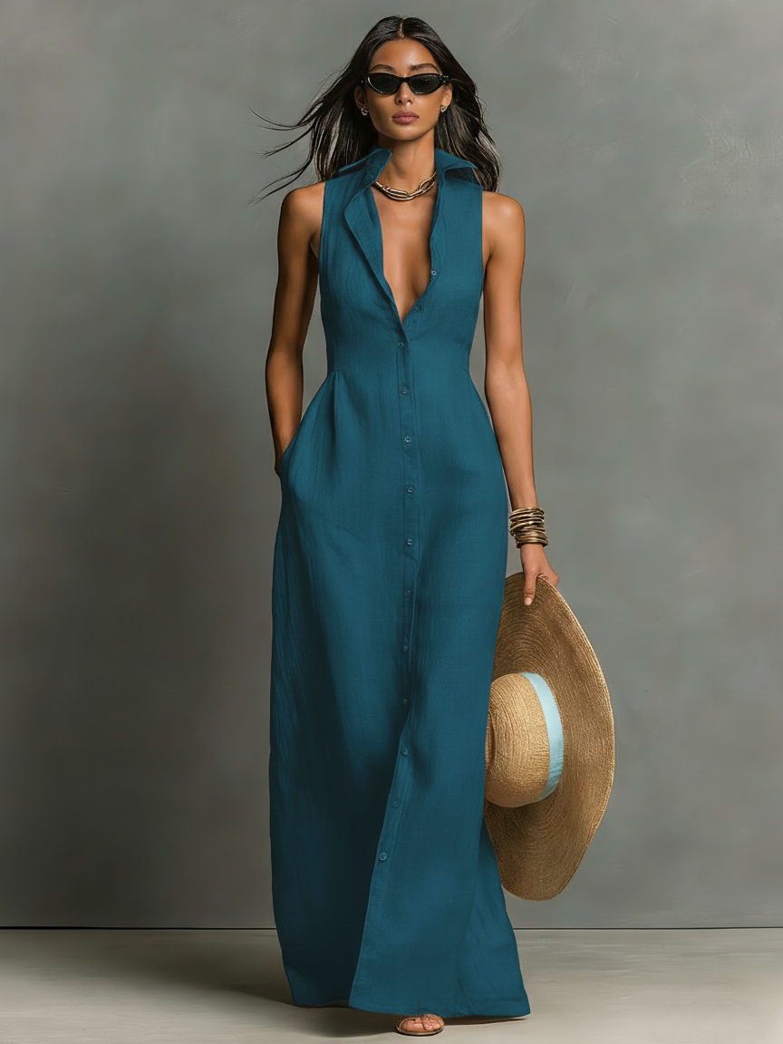 Teal Blue - A woman wearing a sleeveless red maxi dress with a point collar, button-down front, and side pockets, holding a wide-brimmed straw hat.