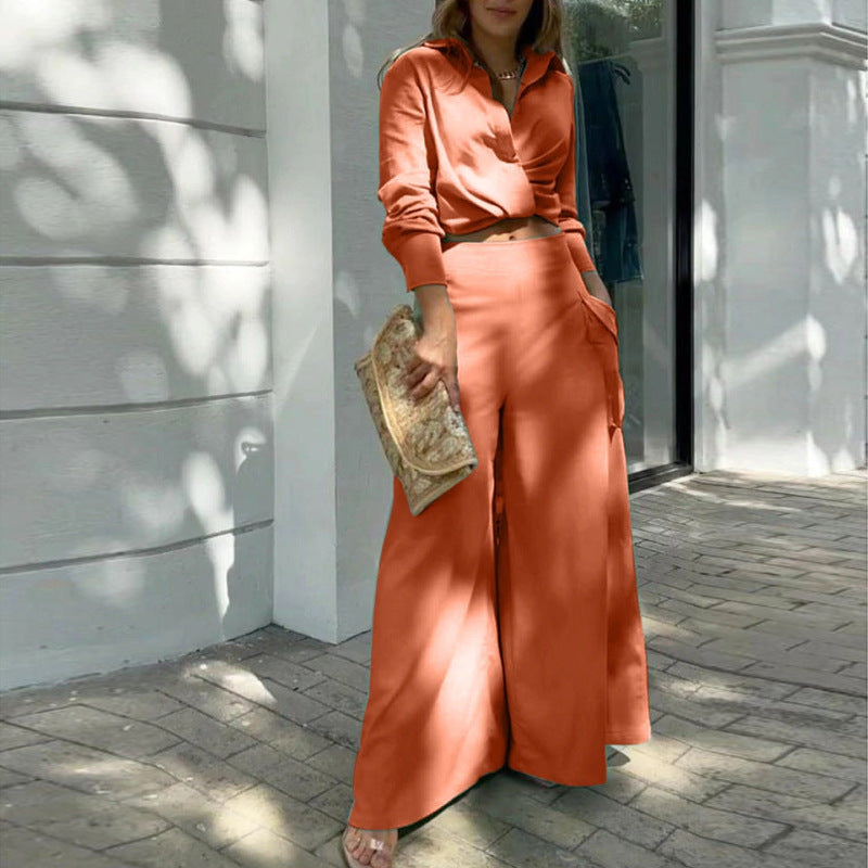 Orange - Women's beige two-piece set featuring a long-sleeve collared crop top and high-waisted wide-leg pants with large cargo pockets, worn outdoors.