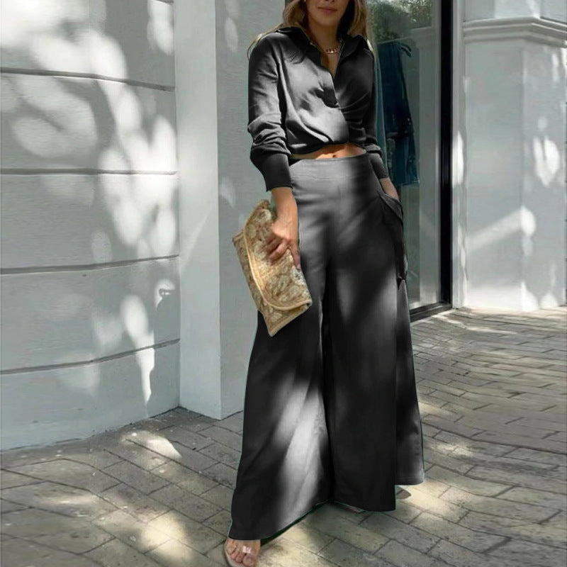 Black - Women's beige two-piece set featuring a long-sleeve collared crop top and high-waisted wide-leg pants with large cargo pockets, worn outdoors.